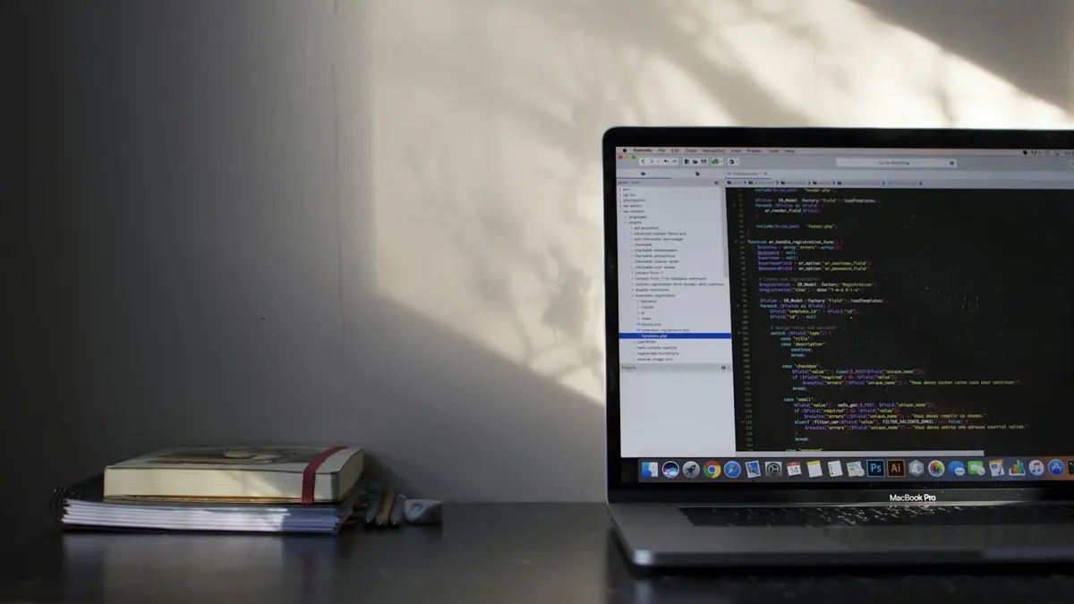 An engineer writing code on a laptop