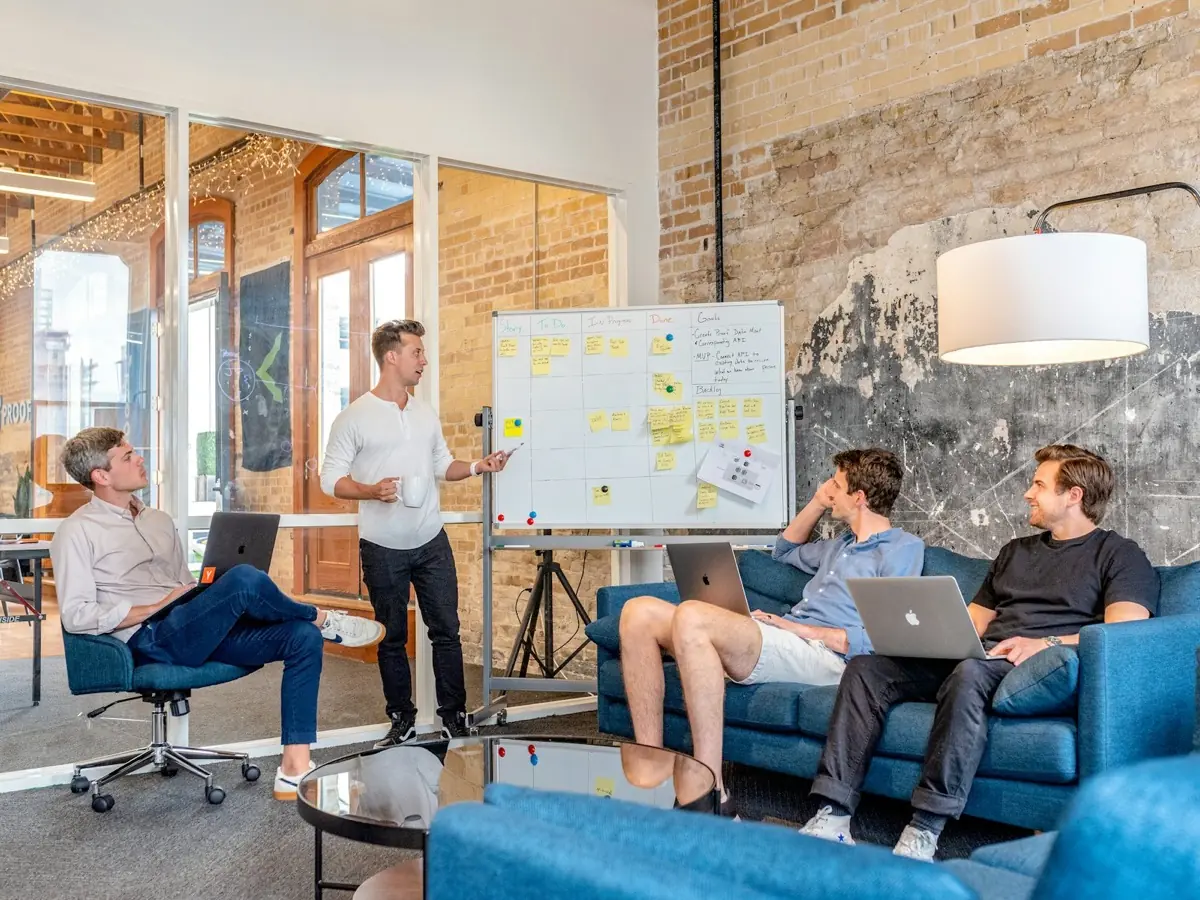A team planning together at a whiteboard