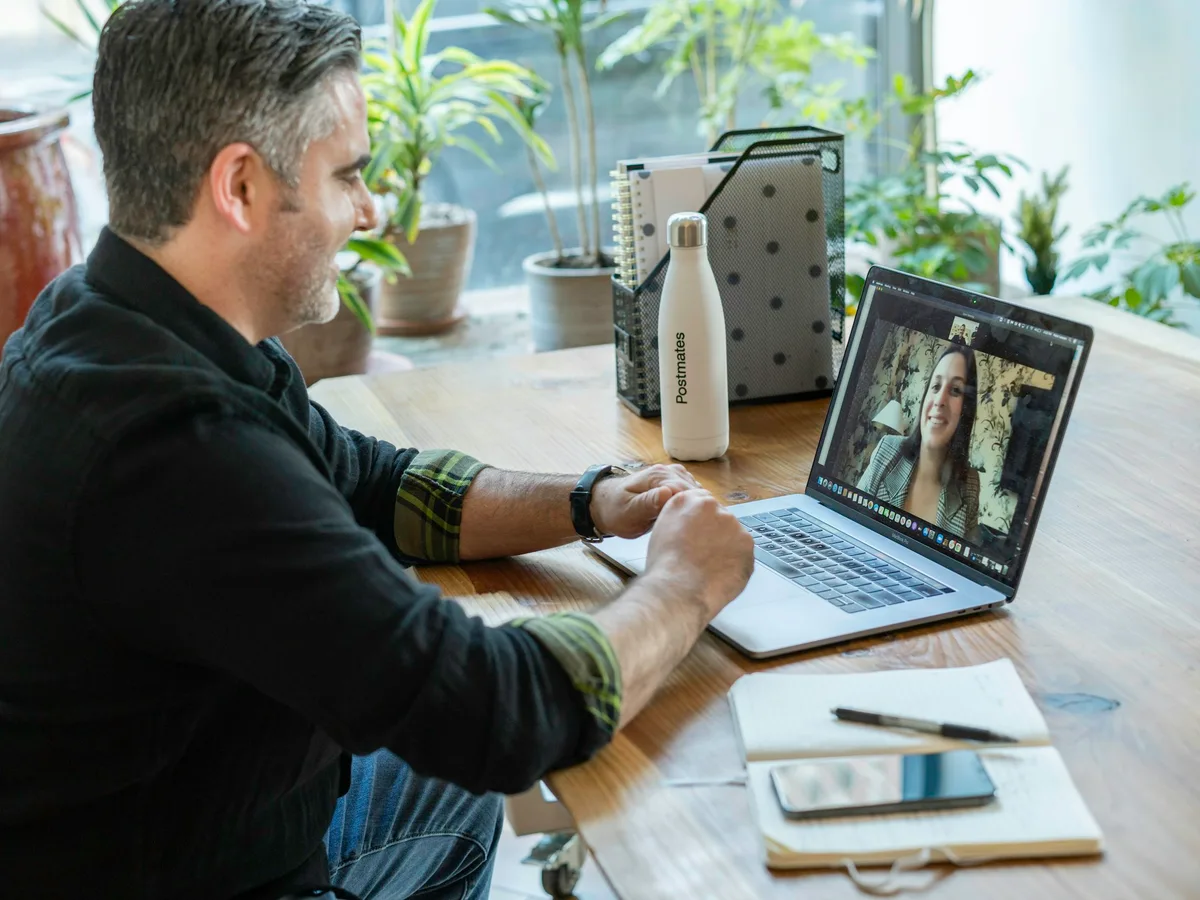 A client interviewing an engineer on a video call